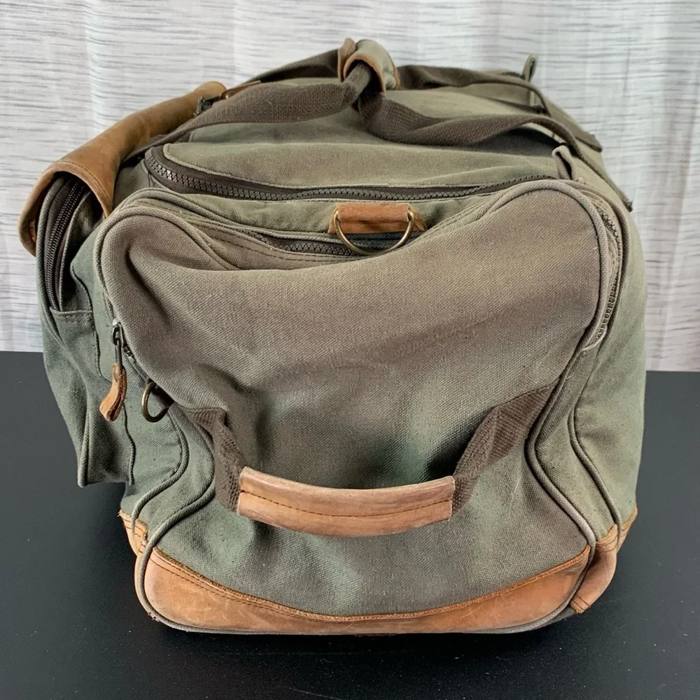 High Sierra Green canvas and Brown leather Duffel Bag.